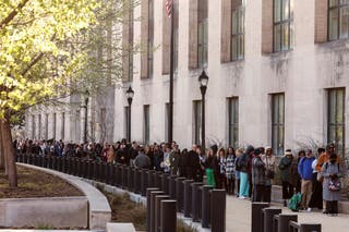 Employees of the Department of Health and Human Services (HHS) stand outside the Mary E. Switzer Memorial Building after it was reported that the Trump administration staff at the Centers for Disease Control and Prevention and dismissed at the Food and Drug Administration as it tackled with the plan to cut 10,000 posts at HHS